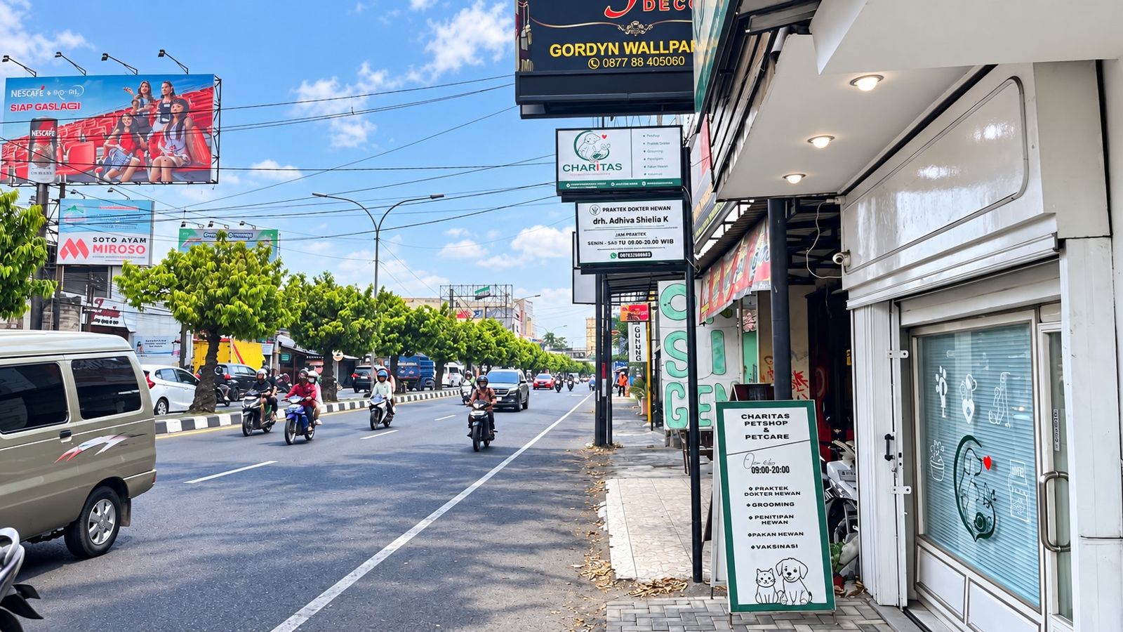 Papan nama Charitas di tepi Jl. Laksda Adisucipto